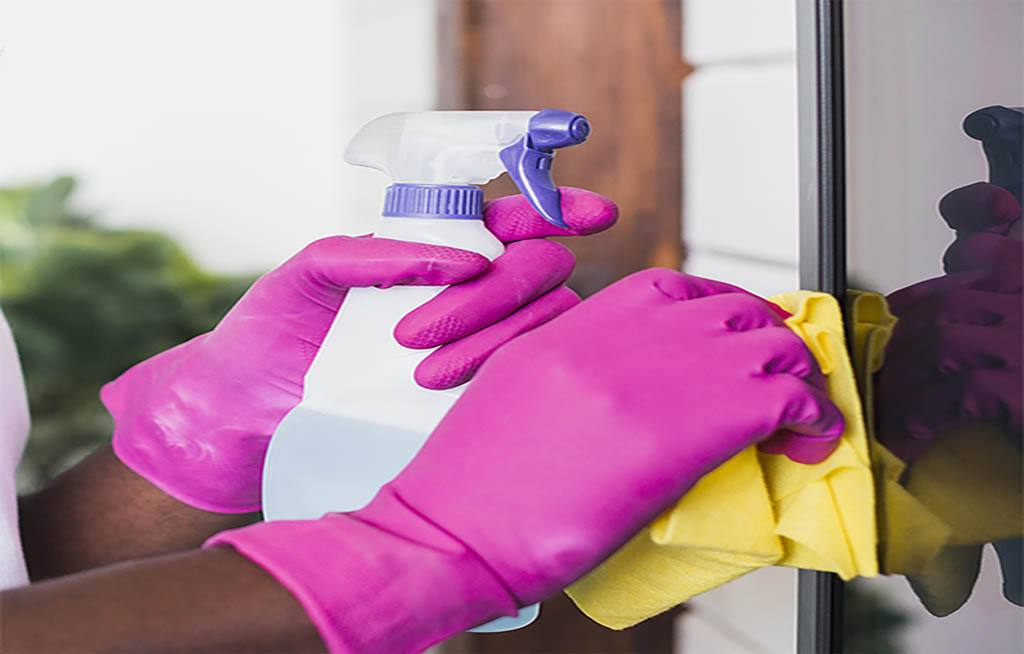 close-up-hands-holding-cleaning-supplies-summit-corp_thomb_nail_size